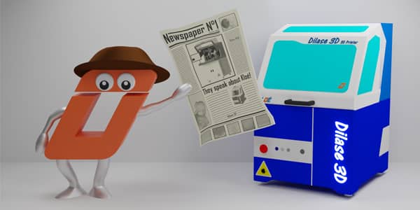 O wearing hat and holding newspaper alongside high resolution 3d printer Dilase 3D
